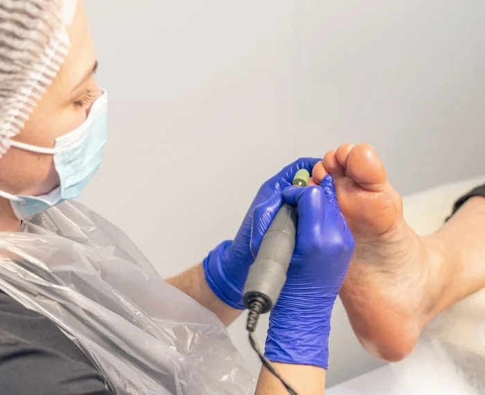 Podiatry and podology foot assessment and care for pain, skin and nail problems, and gait-related issues (illustrative).