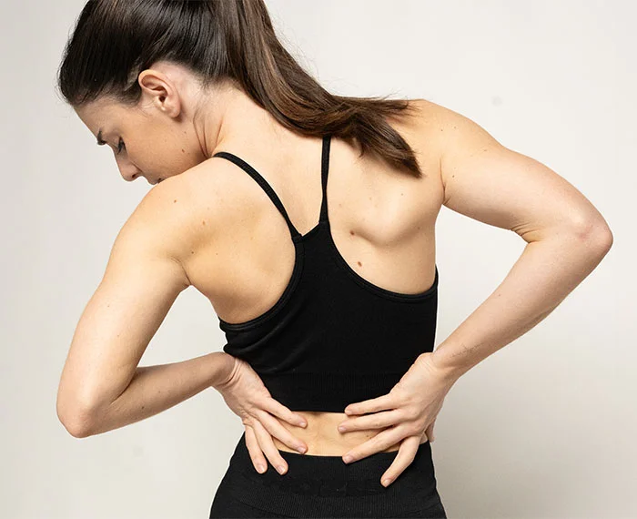 Illustration of a spinal disc problem and nerve compression patterns treated with minimally invasive disc decompression such as nucleoplasty (illustrative).